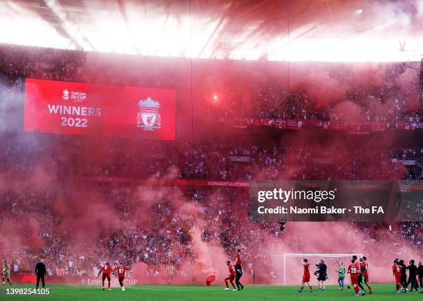 Liverpool fans set of flares as their team wins during The FA Cup Final match between Chelsea and Liverpool at Wembley Stadium on May 14, 2022 in...