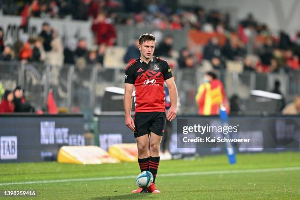 Fergus Burke of the Crusaders looks to kick a conversionduring the round 14 Super Rugby Pacific match between the Crusaders and the Fijian Drua at...