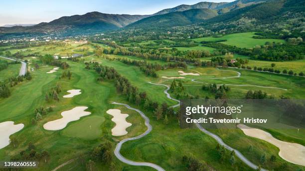 aerial view of green grass and trees on a golf field, fairway and putting green. - bunker campo da golf - fotografias e filmes do acervo