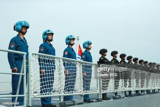 Members of the Chines Navy stand on the deck of a navy ship at a military port on May 18, 2022 in Zhoushan, Zhejiang Province of China. The 41st...