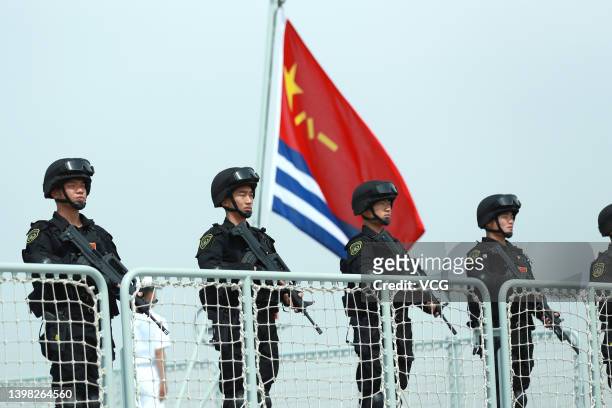 Members of the Chines Navy stand on the deck of a navy ship at a military port on May 18, 2022 in Zhoushan, Zhejiang Province of China. The 41st...