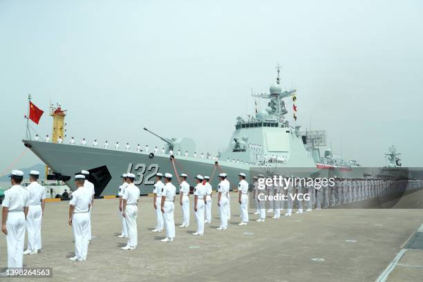 Members of the Chines Navy stand on the deck of the guided-missile destroyer Suzhou of the escort taskforce at a military port on May 18, 2022 in...