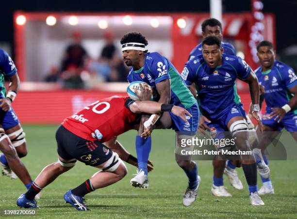 Kalaveti Ravouvou of the Fijian Drua is tackled by Corey Kellow of the Crusaders during the round 14 Super Rugby Pacific match between the Crusaders...