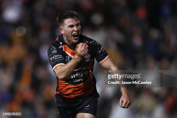 Jock Madden of the Tigers celebrates scoring a try during the round 11 NRL match between the Wests Tigers and the Canterbury Bulldogs at Leichhardt...