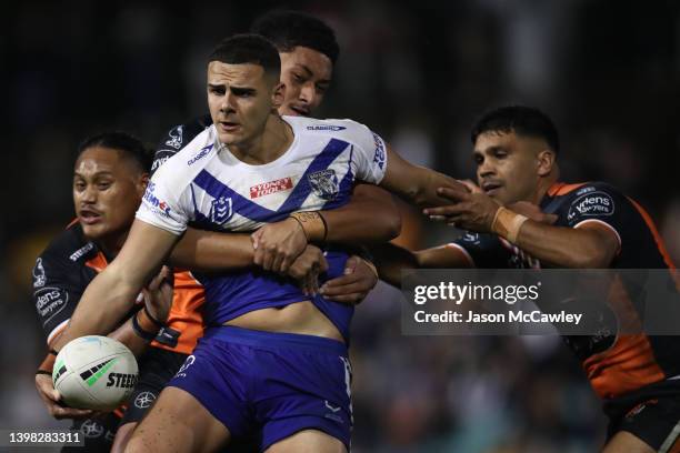 Jacob Kiraz of the Bulldogs is tackled during the round 11 NRL match between the Wests Tigers and the Canterbury Bulldogs at Leichhardt Oval on May...