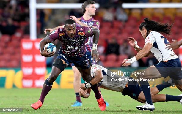 Suliasi Vunivalu of the Reds attempts to break away from the defence during the round 14 Super Rugby Pacific match between the Queensland Reds and...