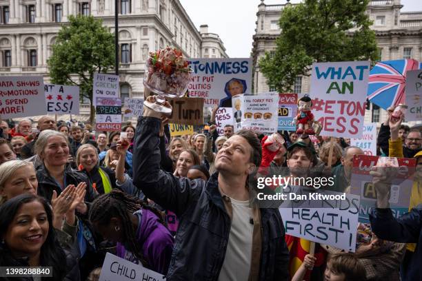 Celebrity chef Jamie Oliver stages a protest outside 10 Downing Street on May 20, 2022 in London, England. The 'Eton Mess' demonstration was aimed at...