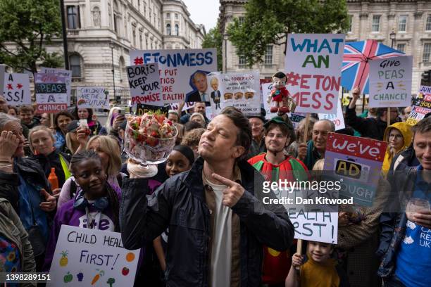 Celebrity chef Jamie Oliver stages a protest outside 10 Downing Street on May 20, 2022 in London, England. The 'Eton Mess' demonstration was aimed at...