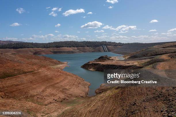 low water levels during a drought - reservoir stock pictures, royalty-free photos & images