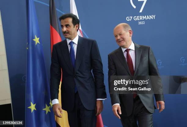 German Chancellor Olaf Scholz and Sheikh Tamim bin Hamad al Thani, Emir of Qatar, depart after speaking to the media following talks at the...