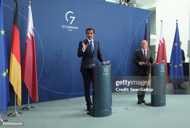 German Chancellor Olaf Scholz and Sheikh Tamim bin Hamad al Thani, Emir of Qatar, speak to the media following talks at the Chancellery on May 20,...