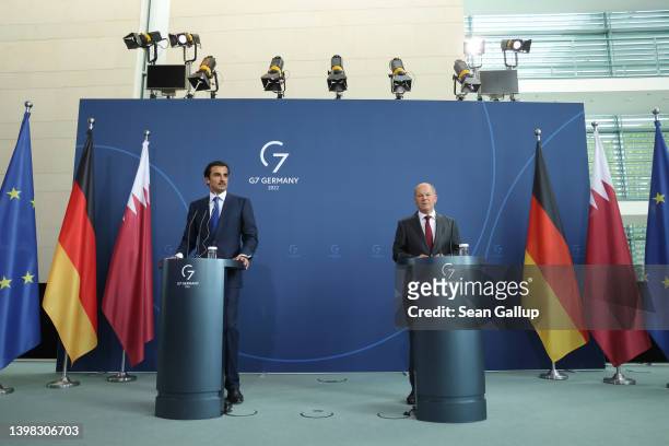 German Chancellor Olaf Scholz and Sheikh Tamim bin Hamad al Thani, Emir of Qatar, speak to the media following talks at the Chancellery on May 20,...
