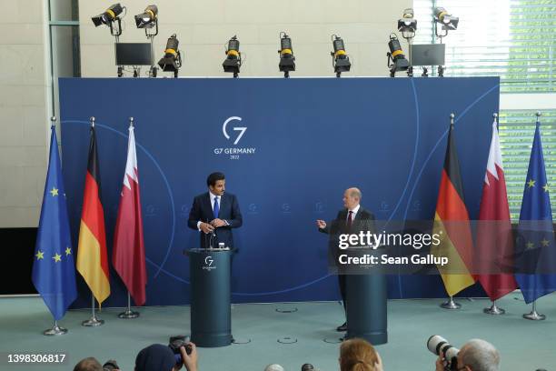 German Chancellor Olaf Scholz and Sheikh Tamim bin Hamad al Thani, Emir of Qatar, speak to the media following talks at the Chancellery on May 20,...