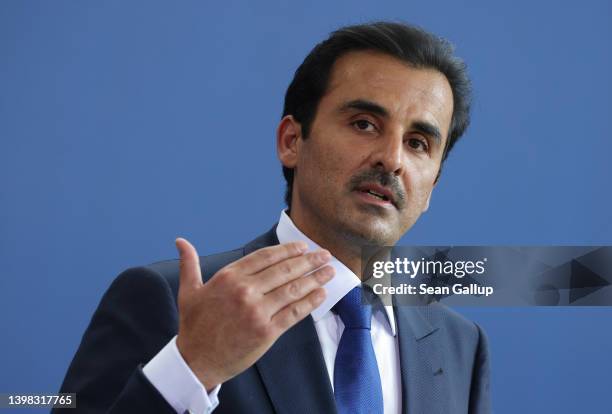 Sheikh Tamim bin Hamad al Thani, Emir of Qatar, and German Chancellor Olaf Scholz speak to the media following talks at the Chancellery on May 20,...