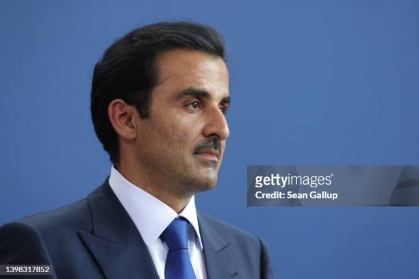 Sheikh Tamim bin Hamad al Thani, Emir of Qatar, and German Chancellor Olaf Scholz speak to the media following talks at the Chancellery on May 20,...
