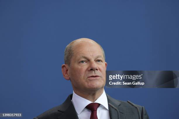 German Chancellor Olaf Scholz and Sheikh Tamim bin Hamad al Thani , Emir of Qatar, speak to the media following talks at the Chancellery on May 20,...