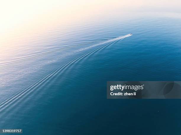 aerial view of a yacht sailing on the sea - wake water stock pictures, royalty-free photos & images