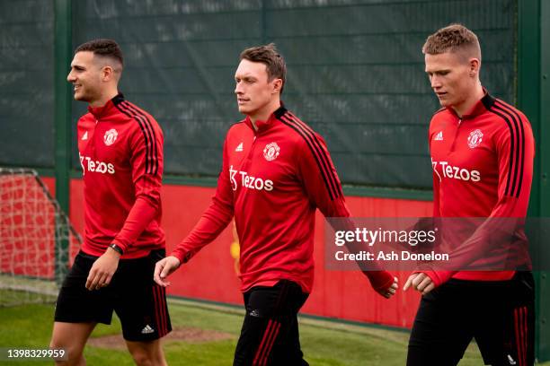 Diogo Dalot, Phil Jones, Scott McTominay of Manchester United in action during a first team training session at Carrington Training Ground on May 20,...