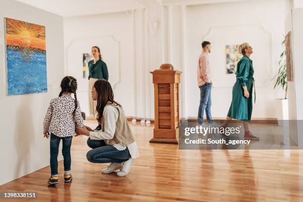 people in art gallery - school fair stock pictures, royalty-free photos & images