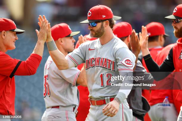 Tyler Naquin of the Cincinnati Reds celebrates the team's 4-2 win over the Cleveland Guardians at Progressive Field on May 19, 2022 in Cleveland,...