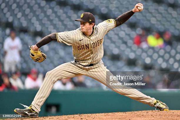 Relief pitcher Tim Hill of the San Diego Padres pitches during the eighth inning of game two of a doubleheader against the Cleveland Guardians at...