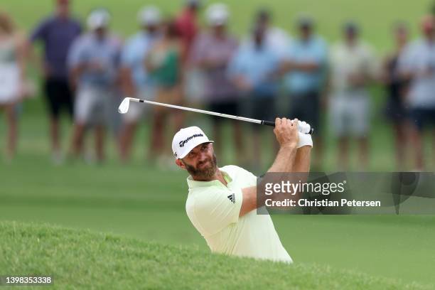 Dustin Johnson of the United States plays a shot from a bunker on the ninth hole during the second round of the 2022 PGA Championship at Southern...