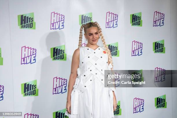Anne Marie poses on the press board during Radio City Hits Live at the M&S Bank Arena on May 20, 2022 in Liverpool, England.