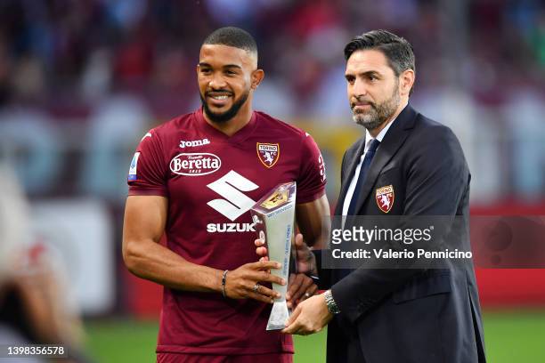 Gleison Bremer of Torino FC is handed the Serie A Most Valuable Defence Player 2021/2022 award from Davide Vagnati, Sporting Director of Torino FC...
