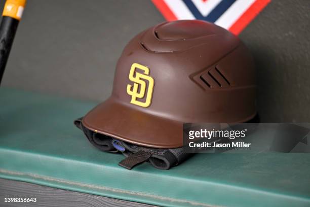 San Diego Padres batting helmet sits in the dugout after game one of a doubleheader against the Cleveland Guardians at Progressive Field on May 04,...