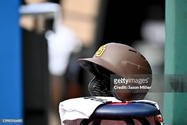 San Diego Padres batting helmet sits near the dugout after game one of a doubleheader against the Cleveland Guardians at Progressive Field on May 04,...
