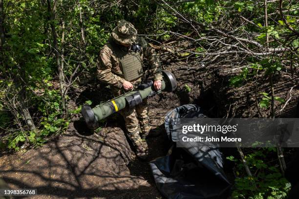 Ukrainian Army soldier places a U.S.-made Javelin missile in a fighting position on the frontline on May 20, 2022 in Kharkiv Oblast, Ukraine....