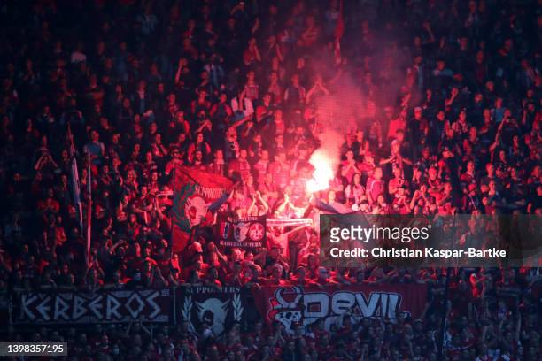 Fans of 1. FC Kaiserslautern light flares in the stands during the Second Bundesliga Playoffs Leg One match between 1. FC Kaiserslautern and Dynamo...