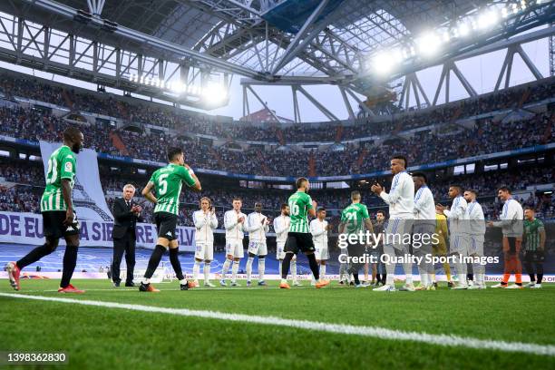 Players of Real Madrid CF line up on the sides to salute plyers of Real Betis during the LaLiga Santander match between Real Madrid CF and Real Betis...