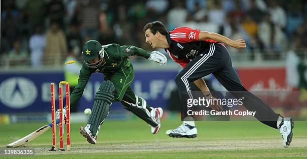 Steven Finn of England runs out Saeed Ajmal of Pakistan during the 2nd International Twenty20 Match between Pakistan and England at Dubai...