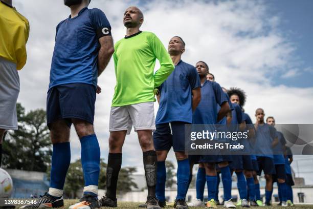 soccer team in a row - football player standing stock pictures, royalty-free photos & images