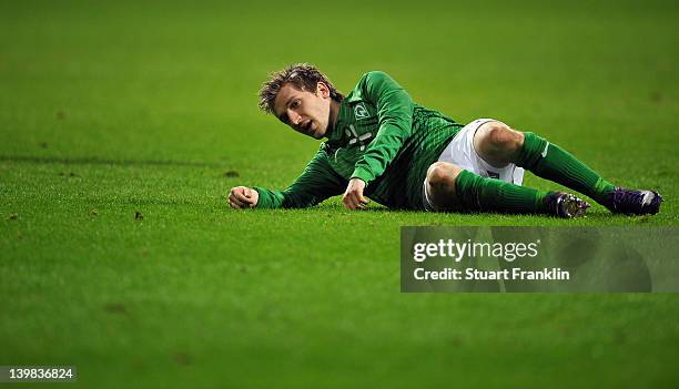 Marko Marin of Bremen lays dejected on the pitch during the Bundesliga match between SV Werder Bremen and 1. FC Nuernberg at Weser Stadium on...