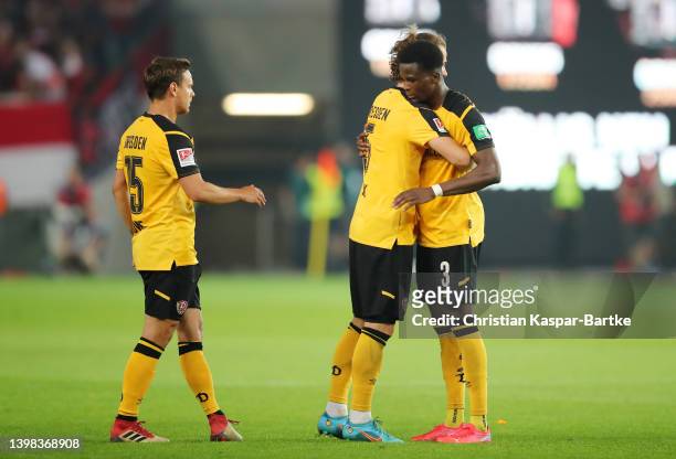 Michael Akoto, Yannick Stark and Chris Loewe of SG Dynamo Dresden interact following their draw in the Second Bundesliga Playoffs Leg One match...