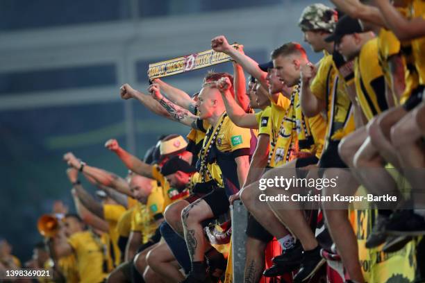 Fans of SG Dynamo Dresden show their support following their draw in the Second Bundesliga Playoffs Leg One match between 1. FC Kaiserslautern and...