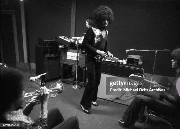 Cynthia Robinson, Sly Stone and bassist Rustee Allen of the psychedelic soul group 'Sly and the Family Stone' record in the studio on April 3, 1973...