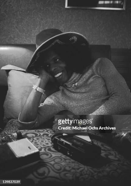 Sly Stone of the psychedelic soul group 'Sly And The Family Stone' poses for a portrait laying on a bed with a tape recorder on August 3, 1973 in New...
