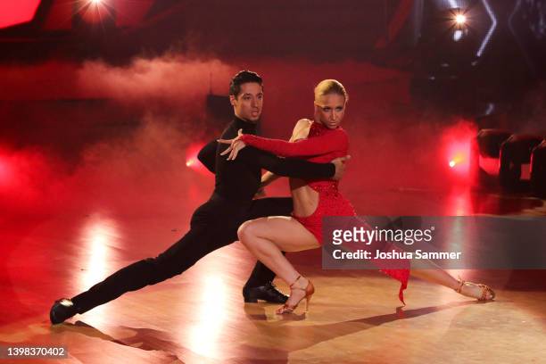 Rene Casselly and Kathrin Menzinger perform on stage during the final show of the 15th season of the television competition show "Let's Dance" at MMC...