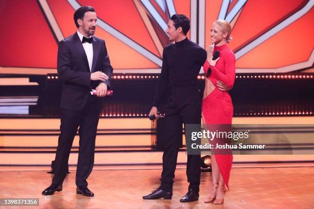 Host, Jan Koppen with Rene Casselly and Kathrin Menzinger perform on stage during the final show of the 15th season of the television competition...