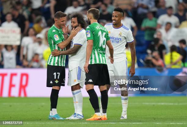 Marcelo of Real Madrid embraces Joaquin of Real Betis during the LaLiga Santander match between Real Madrid CF and Real Betis at Estadio Santiago...