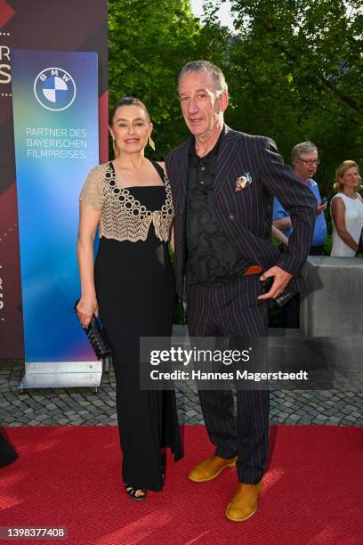 Heio von Stetten and Elisabeth Romano arrives for the Bayerischer Filmpreis 2022 at Prinzregententheater on May 20, 2022 in Munich, Germany.