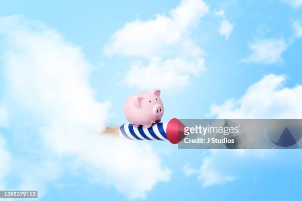 financial freedom concept image of a piggy bank in the clouds - financial freedom stock pictures, royalty-free photos & images
