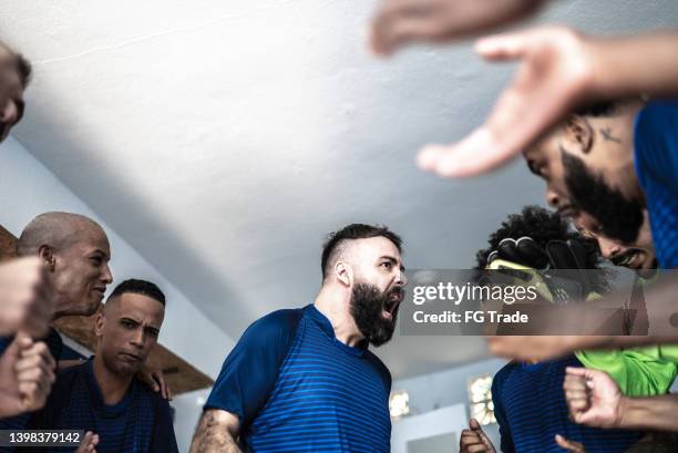 soccer player motivation before match - pep talk stock pictures, royalty-free photos & images