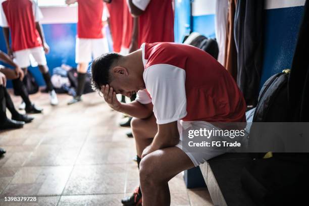 soccer player worried in the locker room - stage fright stock pictures, royalty-free photos & images