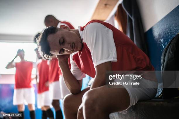 worried soccer player in the locker room - stage fright stock pictures, royalty-free photos & images