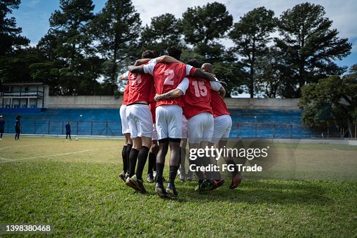 Soccer players celebrating a goal Soccer players celebrating a goal