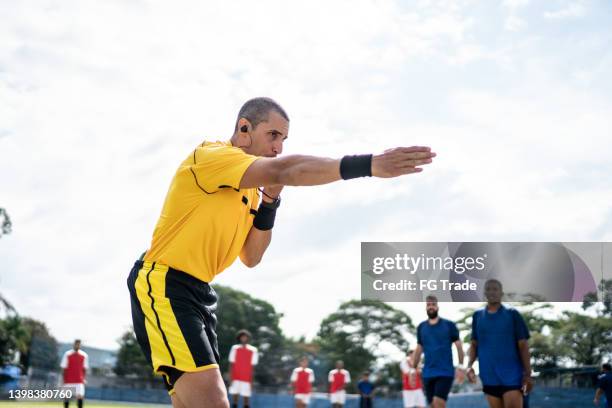 referee whistling during soccer match - överdomare bildbanksfoton och bilder